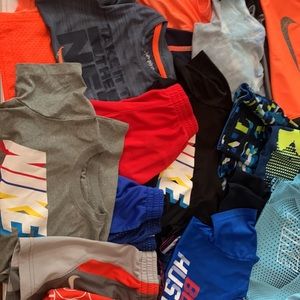 12 pairs of boys size 7 athletic sets. Last pic is a swimsuit and rash gaurd.